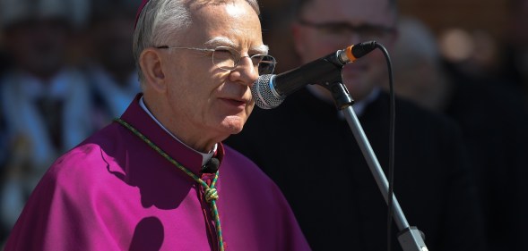 Archbishop of Krakow Marek Jedraszewski addresses the crowd outside Mariacki Basilica in Krakow ahead of the Easter food blessing on Holy Saturday.