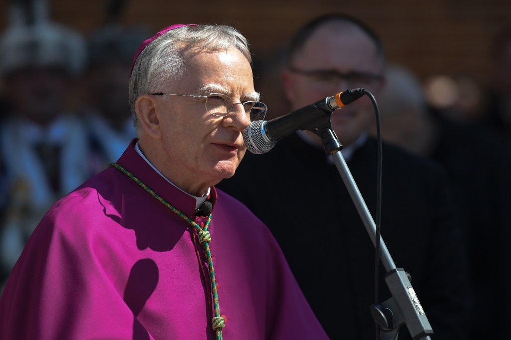 Archbishop of Krakow Marek Jedraszewski addresses the crowd outside Mariacki Basilica in Krakow ahead of the Easter food blessing on Holy Saturday.