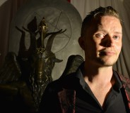 Lucien Greaves, spokesman for The Satanic Temple, with a statue of Baphomet at the group's meeting house in Salem, Massachusetts.
