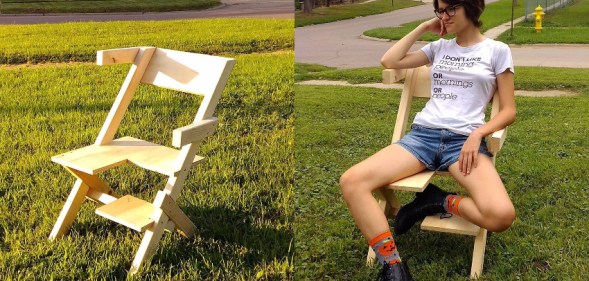 Israel Walker's nonbinary bisexual daughter models the "bi-chair" (Facebook/Israel Walker)