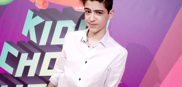 Joshua Rush in a white shirt