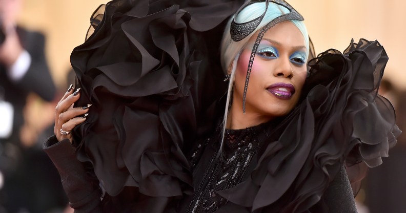 Laverne Cox in a black Christian Siriano gown with an exaggerated shoulder