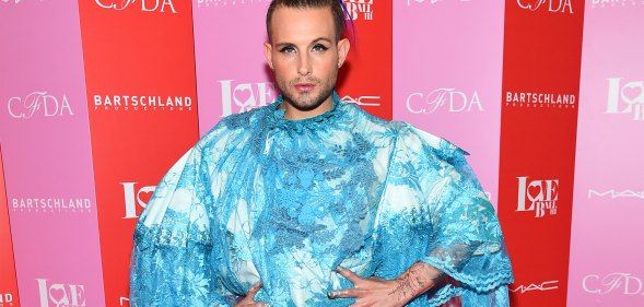 Nico Tortorella in a blue dress