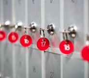 A close-up of grey metal lockers with red key numbers