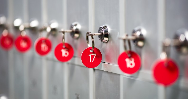 A close-up of grey metal lockers with red key numbers