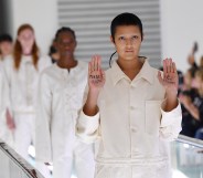 Non-binary model Ayesha Tan Jones protested mid-catwalk against Italian fashion house Gucci's use of straight jackets in its SS20 collection. (Jacopo Raule/Getty Images for Gucci)