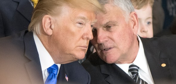 Franklin Graham (R) talks with President Donald Trump