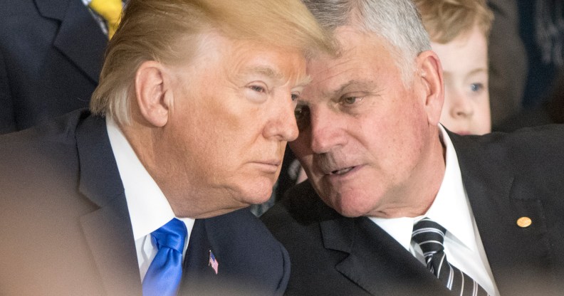 Franklin Graham (R) talks with President Donald Trump