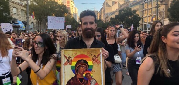 Nik Jovičić-Sas carrying a homemade Virgin Mary icon with a rainbow halo at Belgrade Pride 2019, Serbia. (Nik Jovičić-Sas)