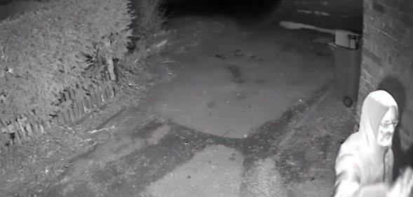 A still from the CCTV footage showing Parsons holding a can of spray paint