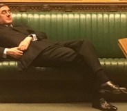 Jacob Rees-Mogg reclining in parliament