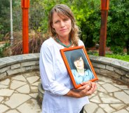 Katharin Prescott holding a photo of her son Kyler