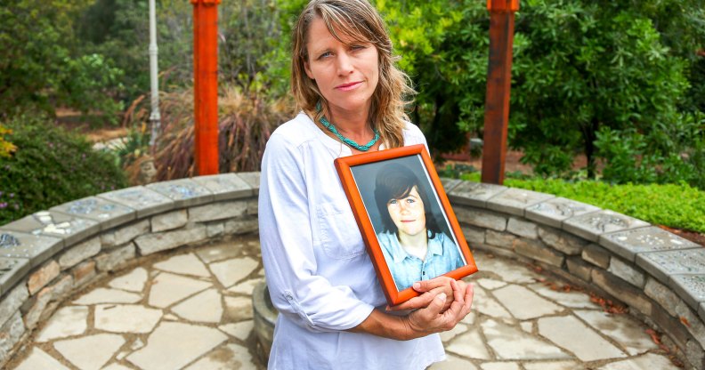 Katharin Prescott holding a photo of her son Kyler