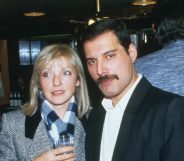 Singer Freddie Mercury (1946 - 1991) of Queen attends Fashion Aid at the Royal Albert Hall in London, with Mary Austin, 5th November 1985. (Dave Hogan/Getty Images)