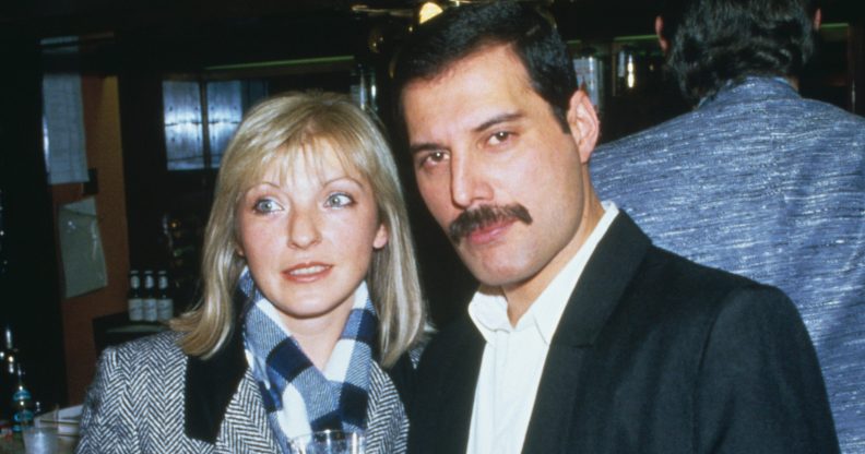 Singer Freddie Mercury (1946 - 1991) of Queen attends Fashion Aid at the Royal Albert Hall in London, with Mary Austin, 5th November 1985. (Dave Hogan/Getty Images)