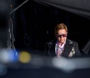 Elton John arrives on stage for his Farewell Yellow Brick Road tour. (FABRICE COFFRINI/AFP/Getty Images)