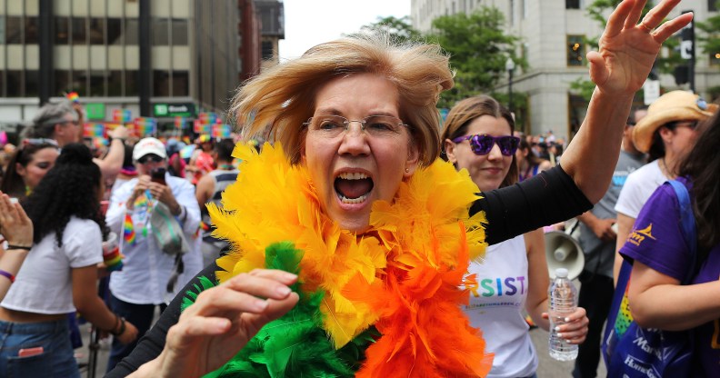 Elizabeth Warren in rainbow feather boa