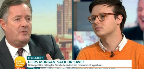 Piers Morgan (L) debated with gay journalist Benjamin Butterworth on whether the Good Morning Britain should should be sacked for his anti-trans comments. (Screen capture via ITV)