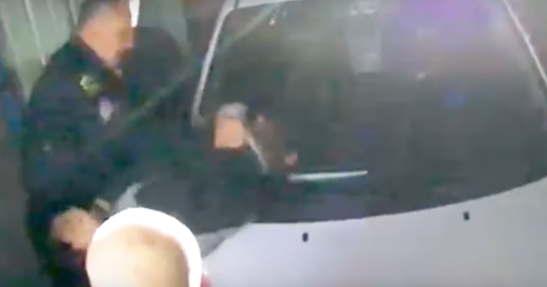 Wayne Benitez pummelling Gustavo Alvarez against a car windshield. (Screen capture via YouTube/The Mercury News)