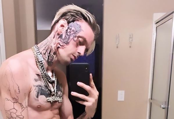 Aaron Carter reveals massive new face tattoo while declaring he's 'the biggest thing in music'. Yes, really