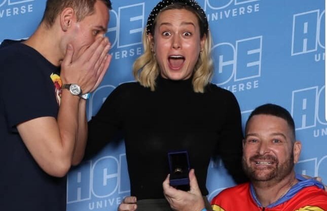 A gay couple got engaged right in front of Brie Larson and her reaction should be framed and hung in the Louvre