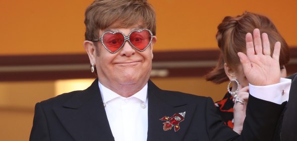 Elton John waving
