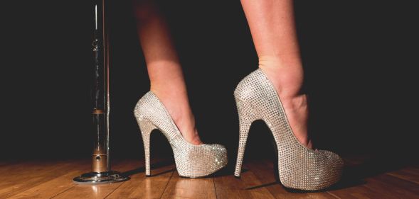 A woman wearing silver heels