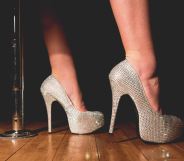 A woman wearing silver heels