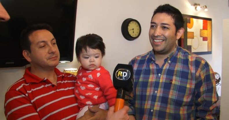 Gay couple adopts baby living with HIV after she was rejected by 10 other families