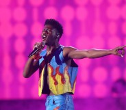 Lil Nas X in a flame print vest