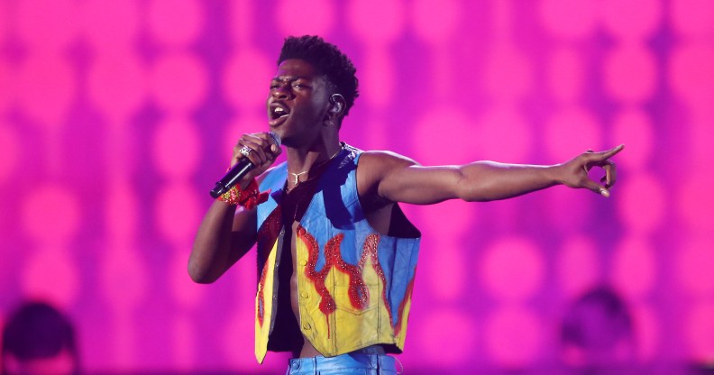 Lil Nas X in a flame print vest