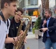 'Homophobic' hate preacher drowned out by street performers with saxophones