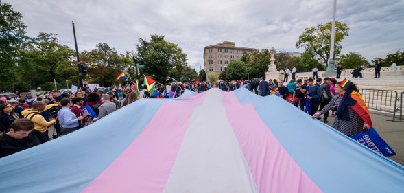A giant trans flag outside the US Supreme Court as a community response to the landmark Supreme Court hearings that could legalise workplace discrimination against LGBTQ+ people