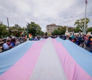 A giant trans flag outside the US Supreme Court as a community response to the landmark Supreme Court hearings that could legalise workplace discrimination against LGBTQ+ people