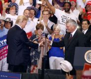Franklin Graham with US President Donald Trump during a Trump rally on August 22, 2017 in Phoenix, Arizona.