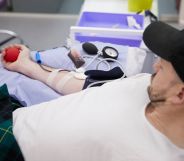 A queer man donates blood at the 'illegal blood bank', set up by activists to highlight backwards laws. (UNILAD)