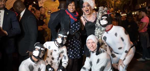 The mayor of Washington DC posing with a drag queen and her pups for Halloween is a huge, huge mood