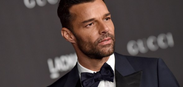 Ricky Martin in a navy blue and black tuxedo