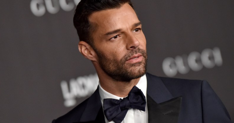Ricky Martin in a navy blue and black tuxedo