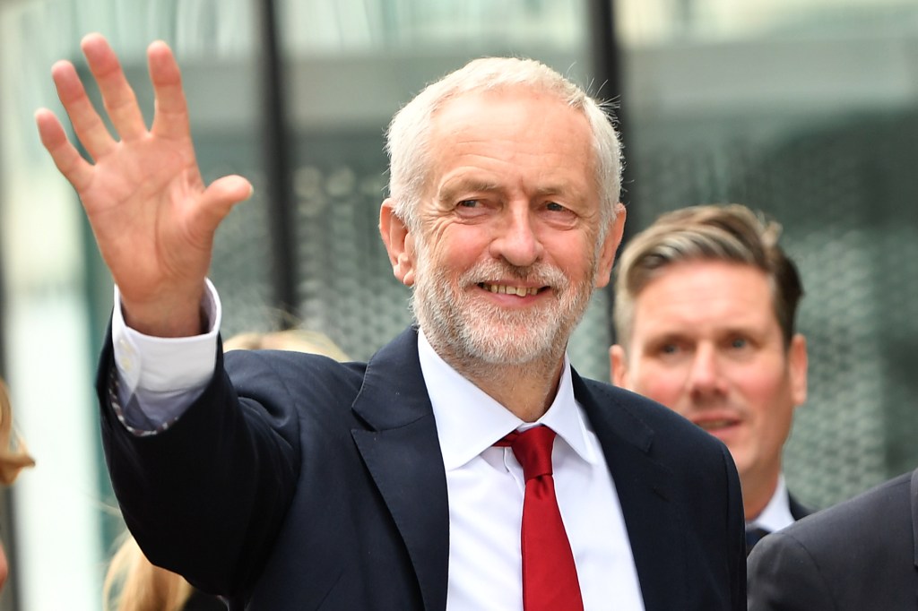 Labour Party leader Jeremy Corbyn waves as he arrives during the Labour Party conference on September 26, 2018. (Anthony Devlin/Getty Images)