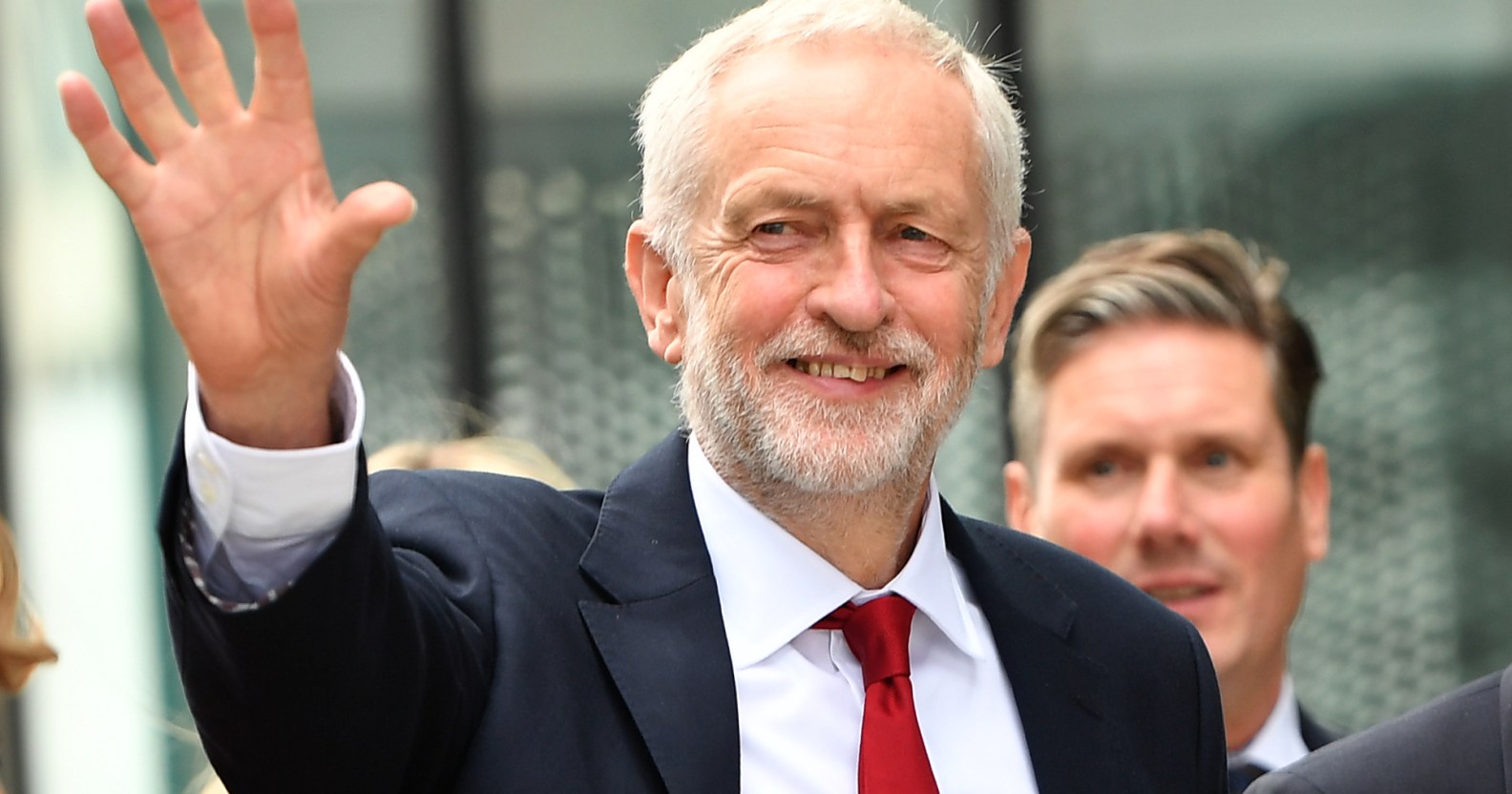 Labour Party leader Jeremy Corbyn waves as he arrives during the Labour Party conference on September 26, 2018. (Anthony Devlin/Getty Images)