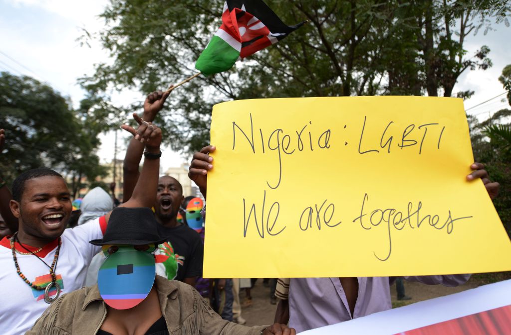 Kenyan gay and lesbian organisations demonstrate outside the Nigerian High Commission in Nairobi, one holding a yellow sign that reads: 'Nigeria: LGBTI, We are together'