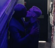 Two men kissing in a stairwell in H&M advert