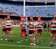 Wigan Warriors players acknowledge their fans at the end of the Betfred Super League between Cataland Dragons and Wigan Warriors match at Camp Nou on May 18, 2019