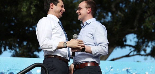 Democratic presidential candidate and South Bend, Indiana Mayor Pete Buttigieg (L) is introduced by his husband, Chasten Glezman Buttigie. (Joe Raedle/Getty Images)