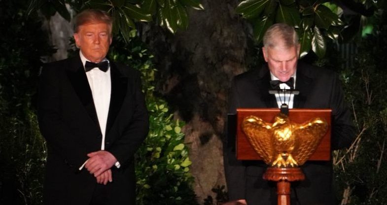 Franklin Graham gives a blessing next to US President Donald Trump at the White House