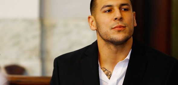 Aaron Hernandez sits in the courtroom of the Attleboro District Court during his hearing on August 22, 2013 in North Attleboro, Massachusetts. (Jared Wickerham/Getty Images)