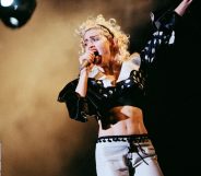 Madonna performs on stage on her Blonde Ambition tour at Wembley Stadium, on July 20th, 1990 in London, England. (Pete Still/Redferns)