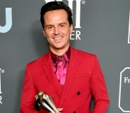 Andrew Scott in a red suit with a fuschia shirt