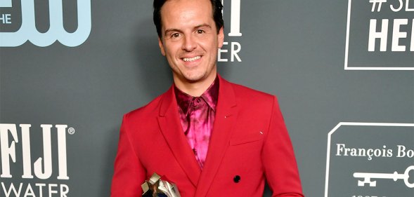 Andrew Scott in a red suit with a fuschia shirt